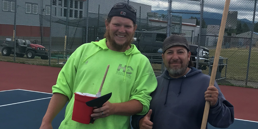 Bobby and Evan grounds work on tennis courts